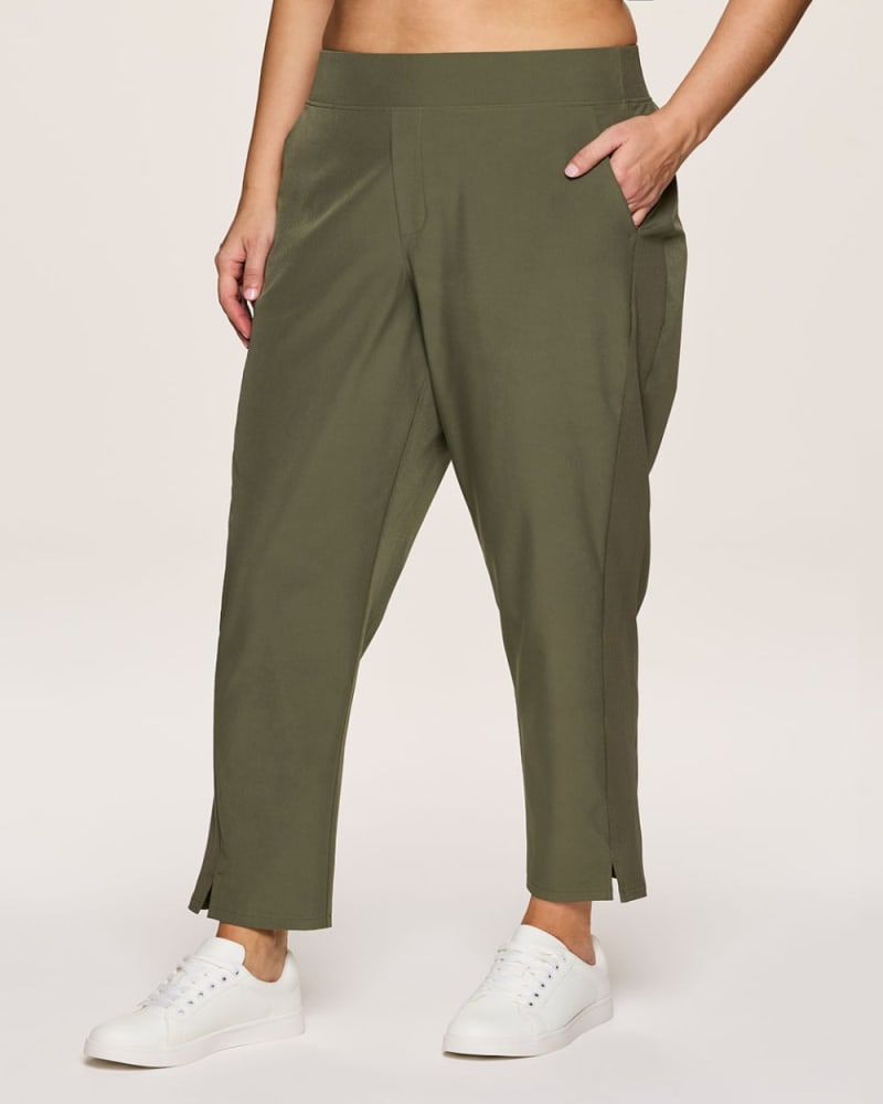 Front of a model wearing a size 1X Plus Everyday Ribbed Ankle Pant in Olive by RBX Active. | dia_product_style_image_id:348477